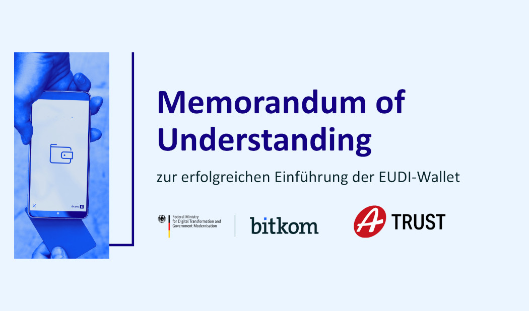 Graphic with the heading 'Memorandum of Understanding for the successful introduction of the EUDI Wallet'. On the left, a hand holds a smartphone displaying a wallet icon. At the bottom, the logos of the Federal Ministry for Digital Transformation and Government Modernisation, Bitkom, and A-Trust are shown.”