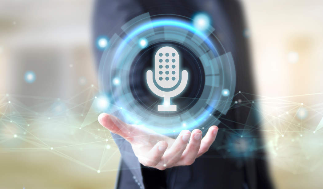 Montage: A hand holds a floating, glowing microphone icon with digital network lines.